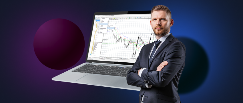 A suited man stands in front of a laptop with a trading chart open, representing the use of popular trading tools for analysis.