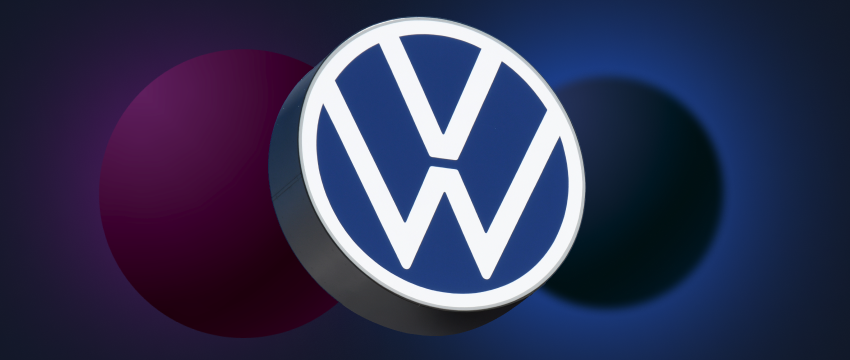 The Volkswagen logo set against a blue backdrop, representing the company's identity in the car stock market.